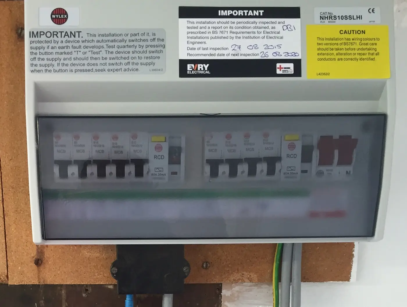 A modern consumer unit with RCD protection, circuit breakers and safety labels