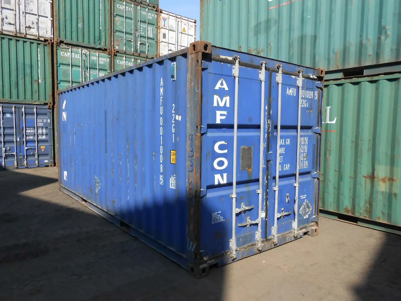 Rows of shipping containers in a surfaced storage yard