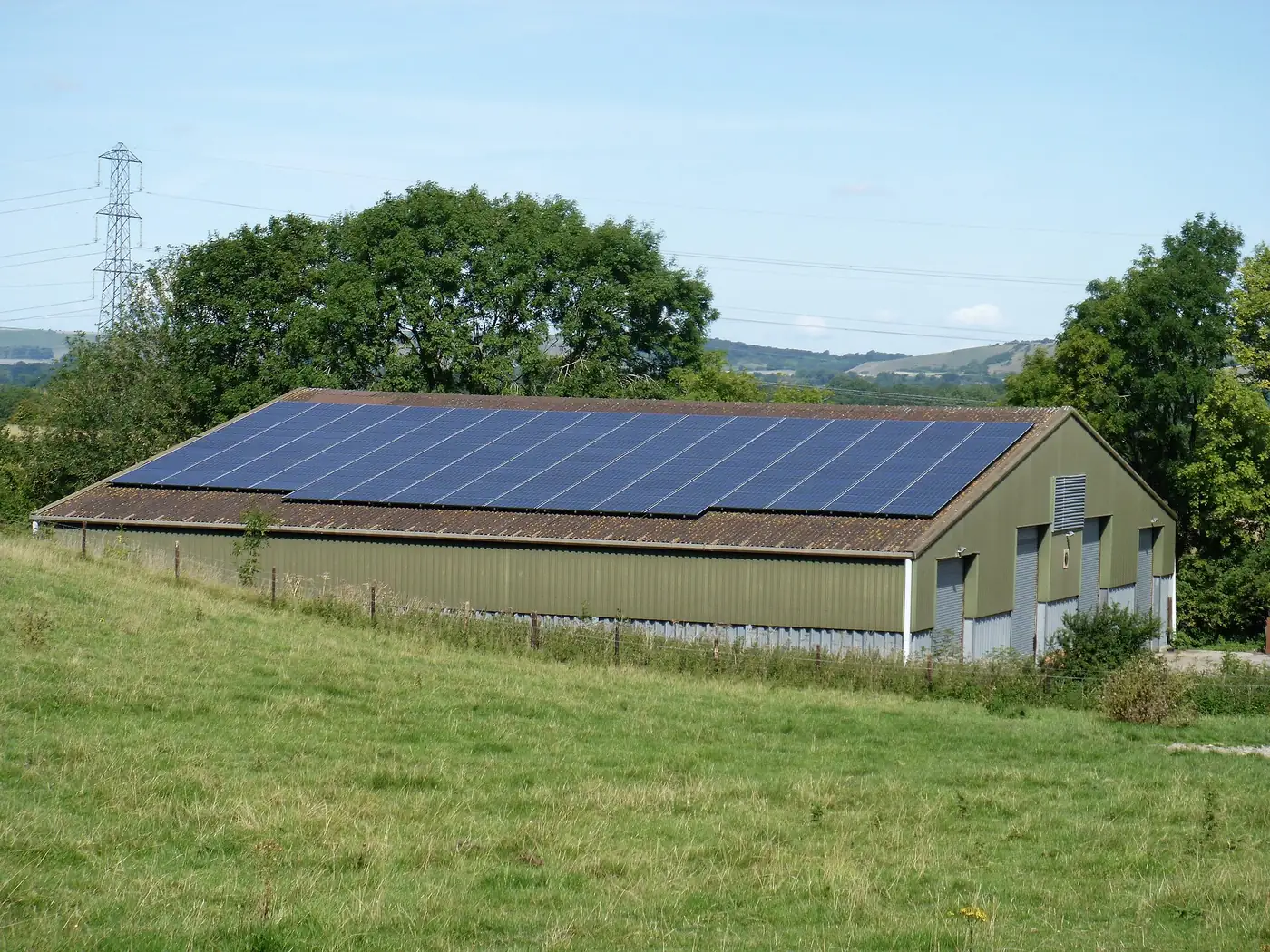 Farm buildings and a concrete yard on an outlying part of a farm
