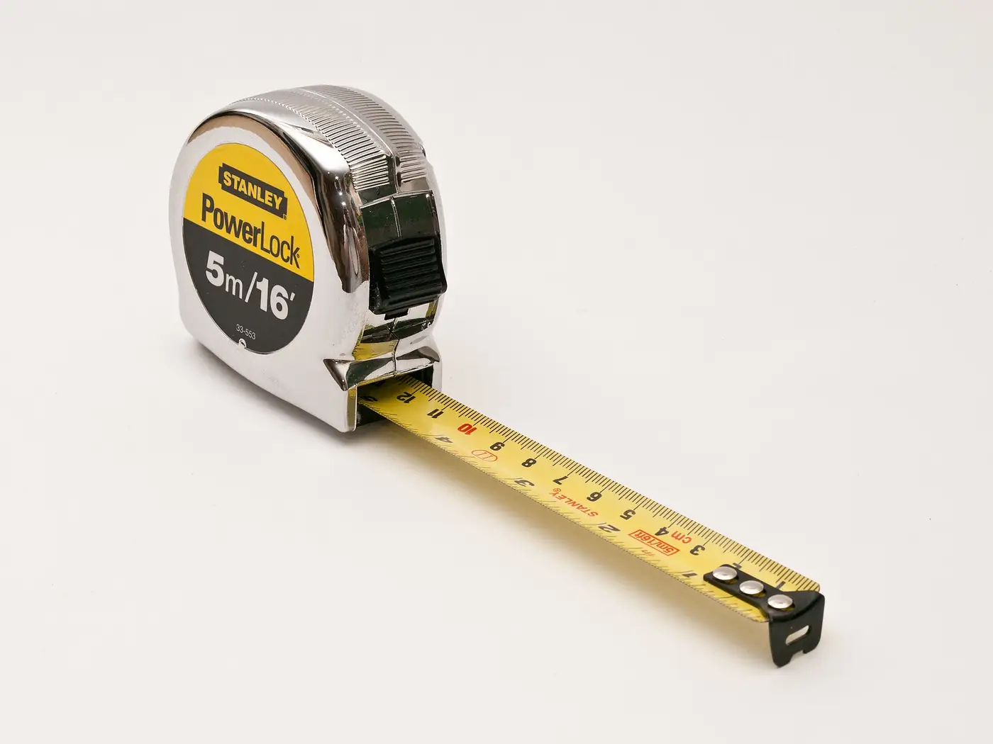 A tape measure extended on a white background